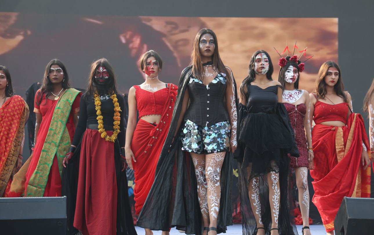 Models on the fashion show runway in red and black