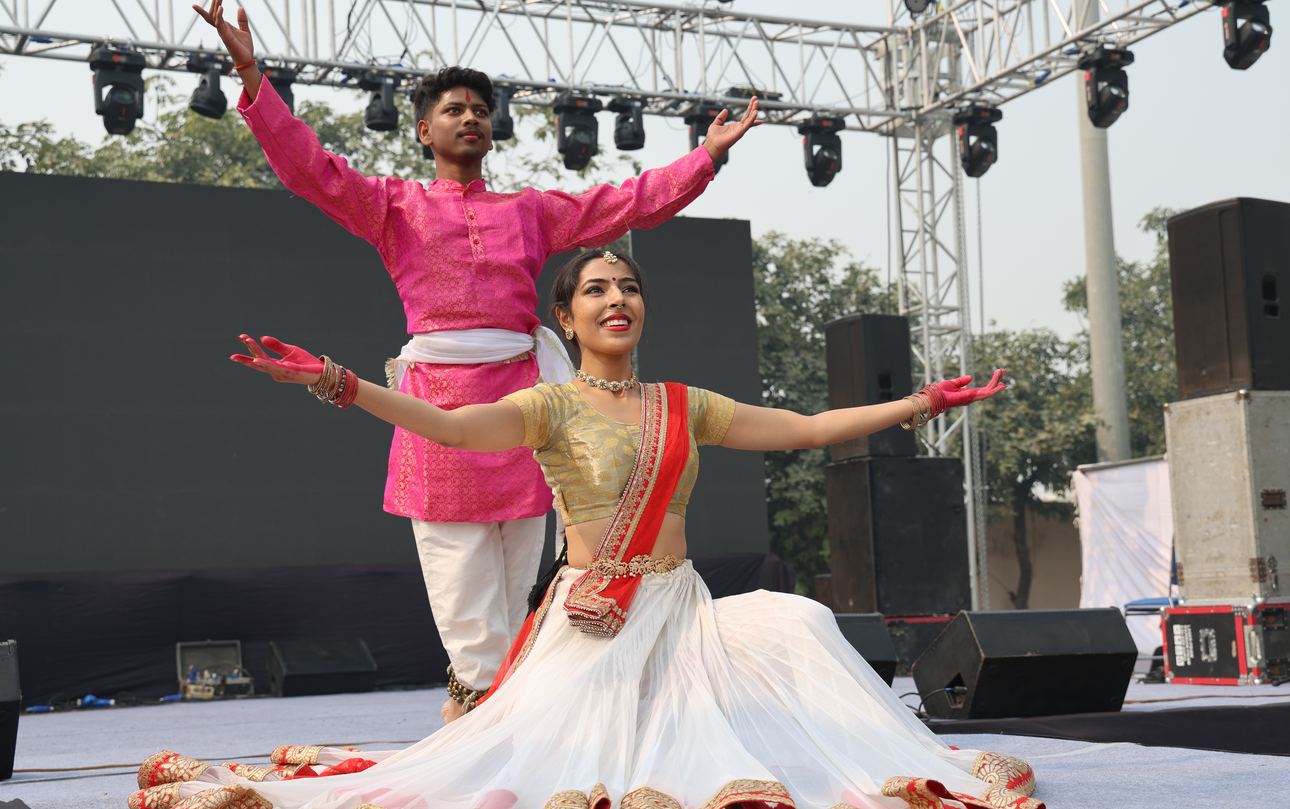 Two dancers performing a classical dance on stage