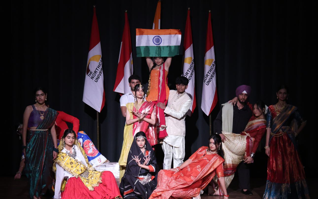 Students in traditional dress at a cultural performance